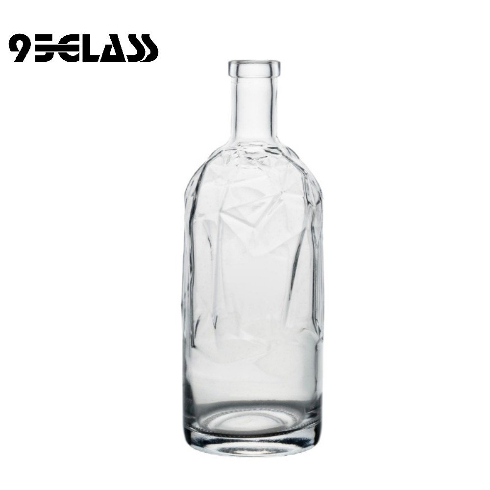Large vodka bottle with faceted crystal-clear glass design for premium spirits.