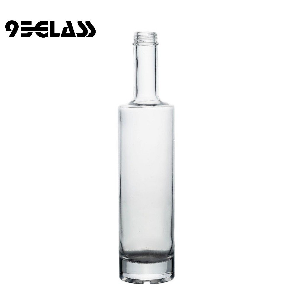 Tall crystal-clear round alcohol bottle – perfect for whiskey, vodka, gin, and spirits.
