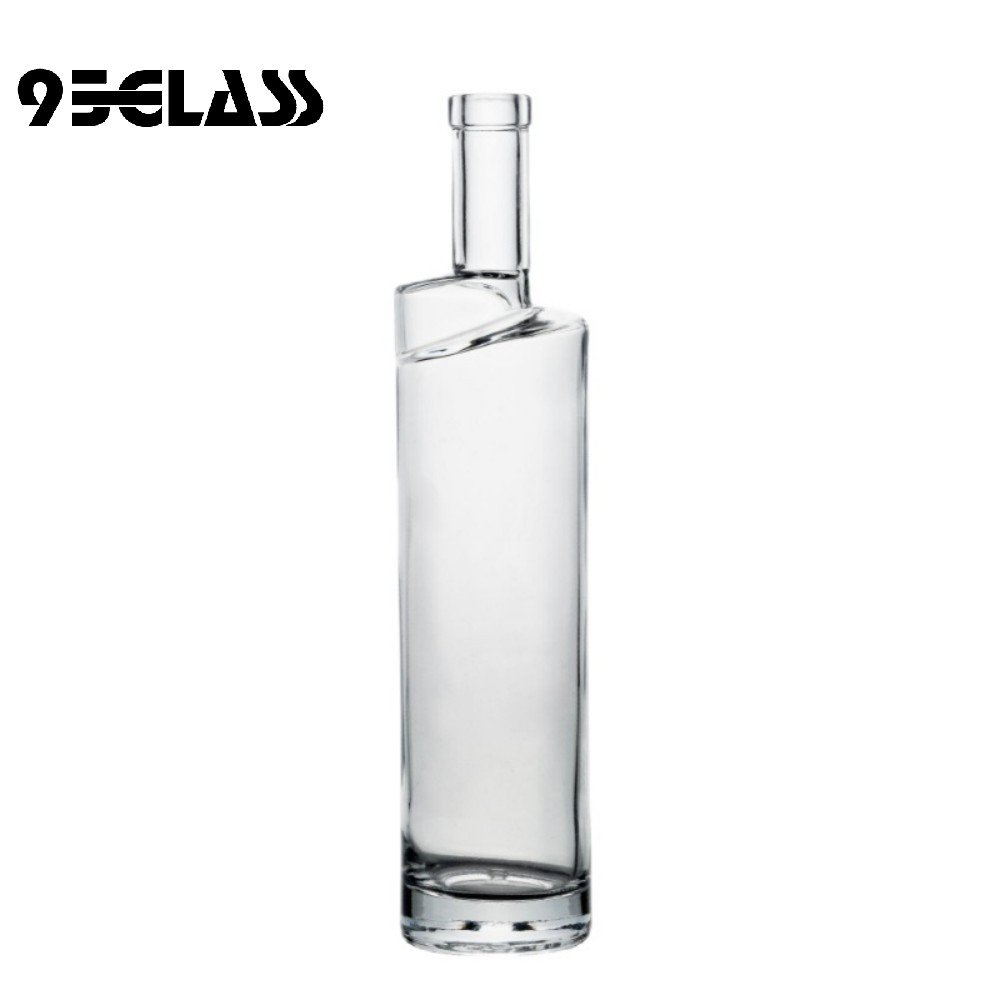 Tall crystal-clear glass bottle with modern slanted neck – ideal personalized liquor bottle for premium spirits.