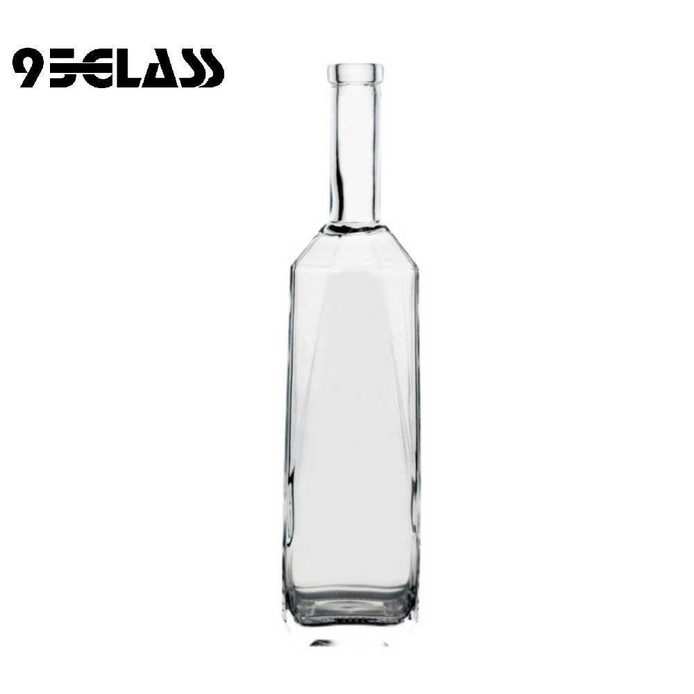 Tall square liquor bottle with slim long neck and heavy base