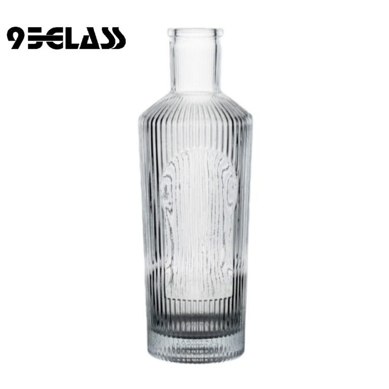 Vertical groove crystal-clear glass spirit bottle for sale with textured body and modern style.