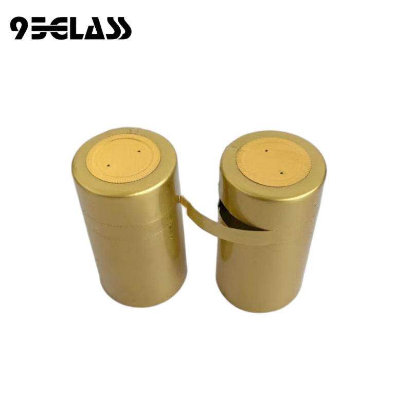 glossy gold tear-strip pvc capsule heat shrinker with round top disc and vent holes