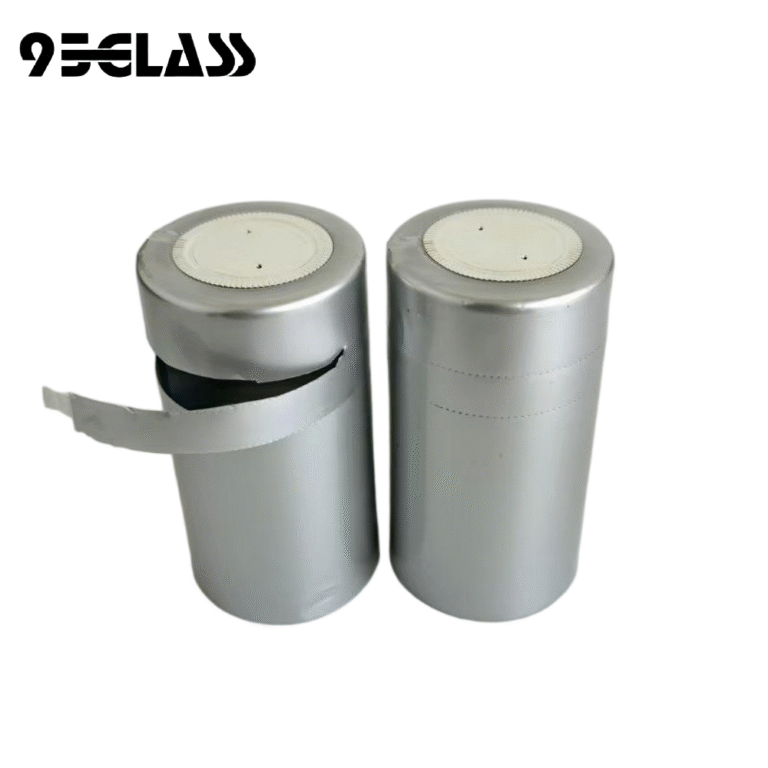 satin silver tear-strip pvc capsule heat shrinker with coin top and twin vent holes