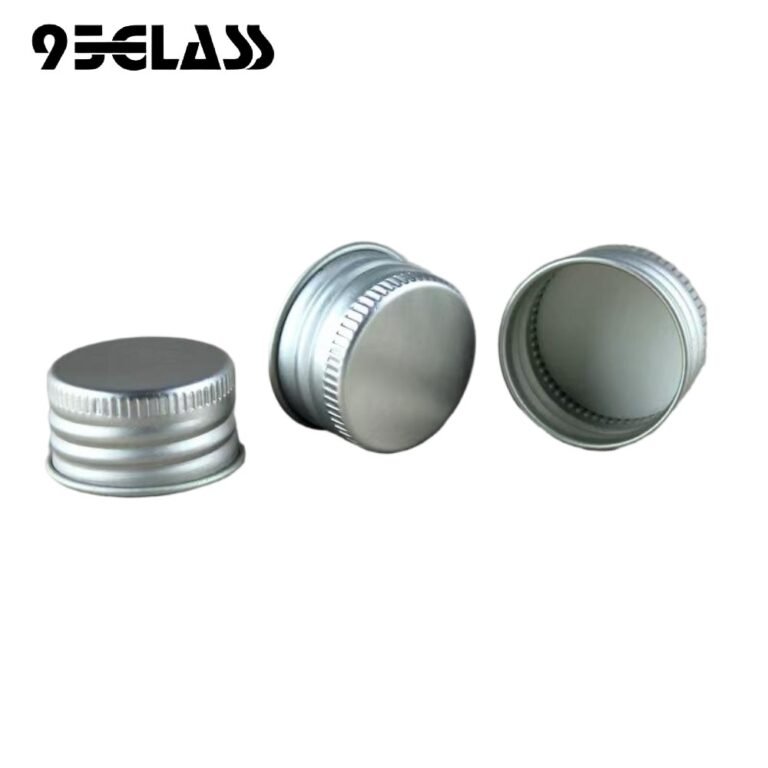 Silver aluminum screw cap with fine knurled side for liquor bottle sealing and easy opening.