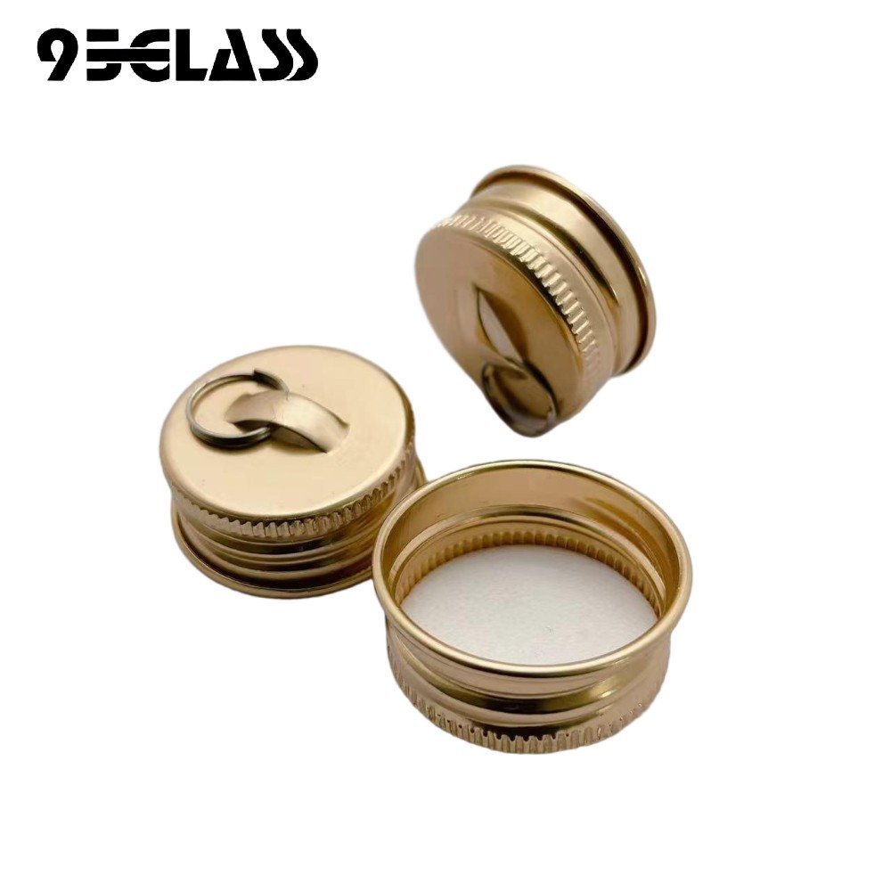 Gold aluminum screw cap with pull ring for liquor bottle, offering easy opening and secure sealing.
