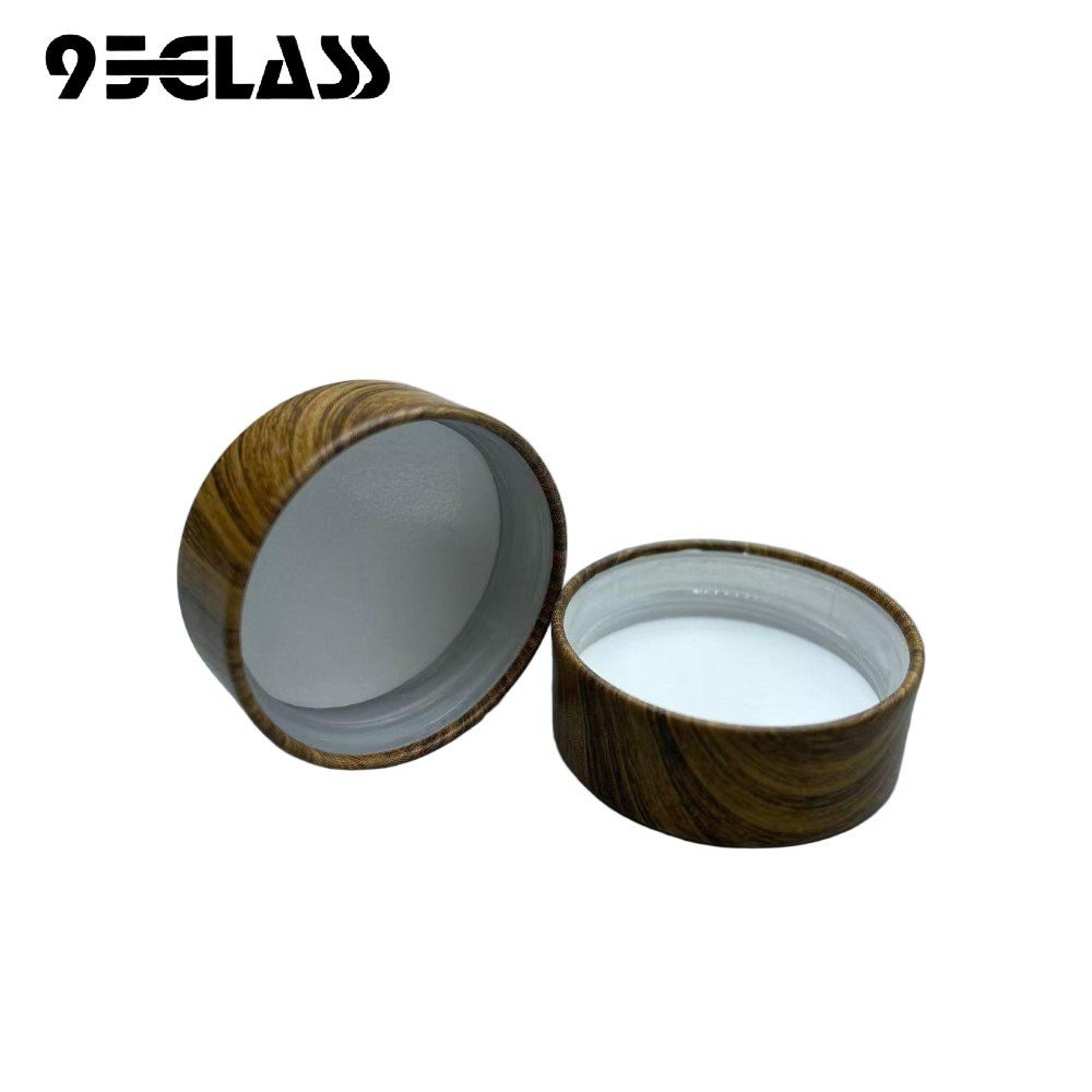Wood grain plastic screw cap with smooth finish for liquor bottles.