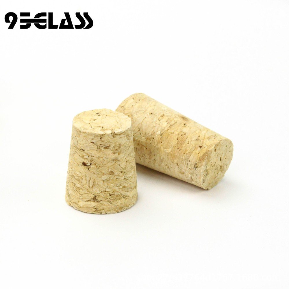 Eco-friendly micro-agglomerated tapered corks with natural texture for liquor and craft bottles.